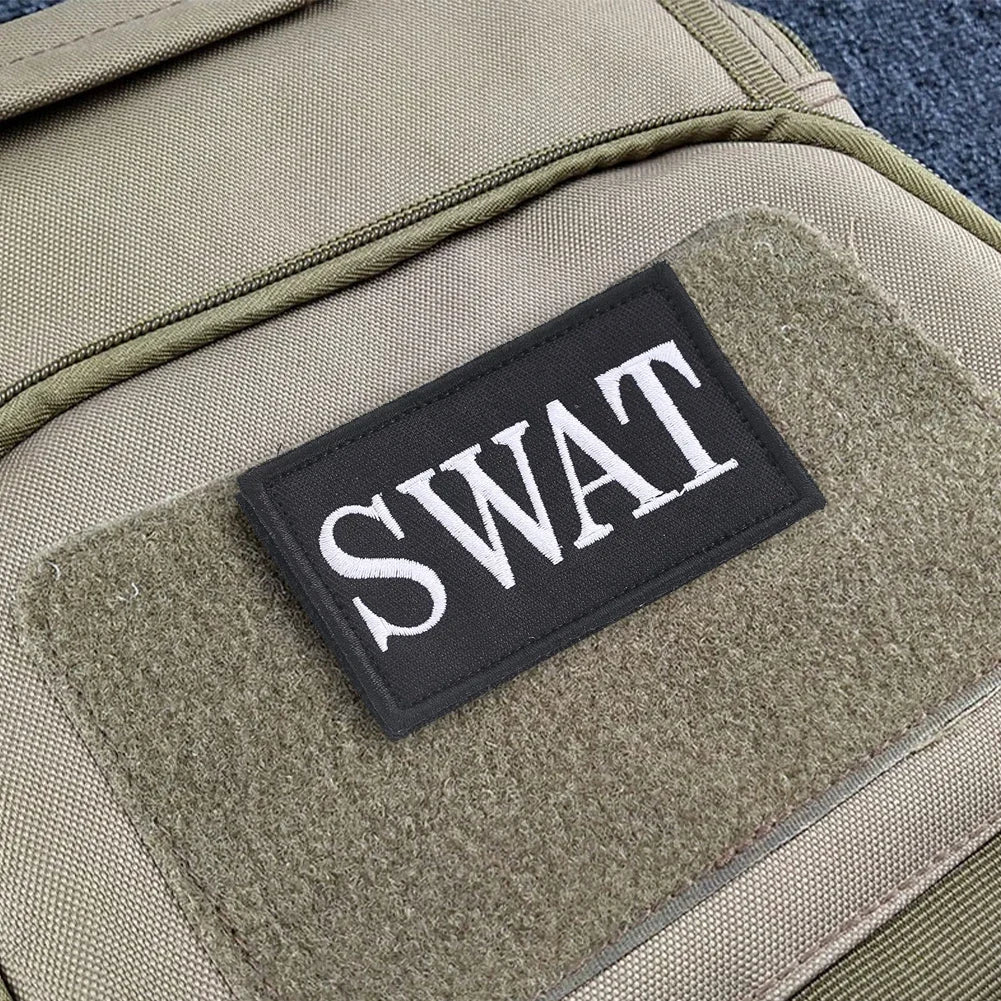 Authentic SWAT Embroidered Morale Patch - Durable High-Quality for Military Airsoft Paintball Gear - Camouflage Background